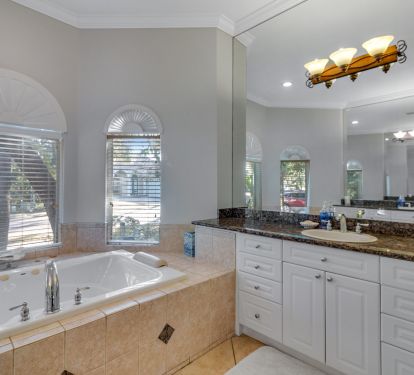 Bath 1 Master bathroom suite has soaking tub, shower and double sinks