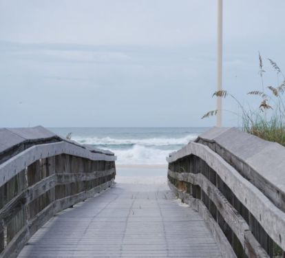 Boardwalk to sugar white, powder soft sand of Seagrove Beach and emerald water