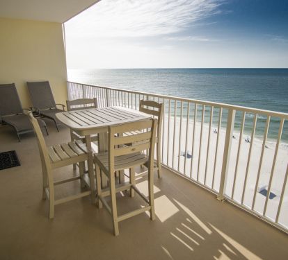 2 lounge chairs and bar height table and chairs