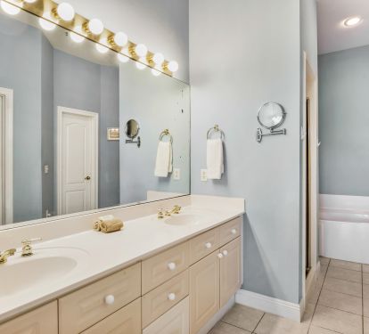 Master Bath has double vanities, walk-in shower, separate tub