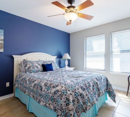 Queen bed with flat screen tv and plenty of closet space