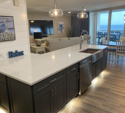 Quartz Countertops in kick-plate under counter kitchen - looking to living area