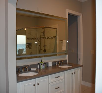 Lighted mirror and two sinks in the master bath with a view - redone in 2022
