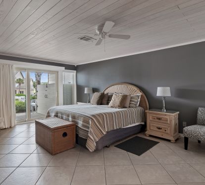 Spacious MBR has king bed, open to separate patio