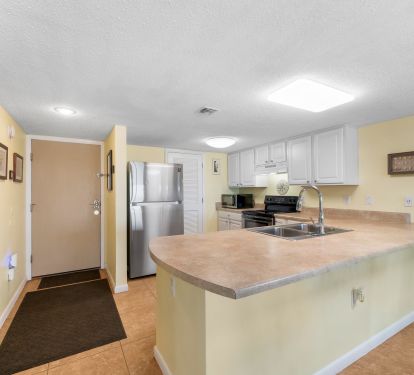 Kitchen on right facing front door