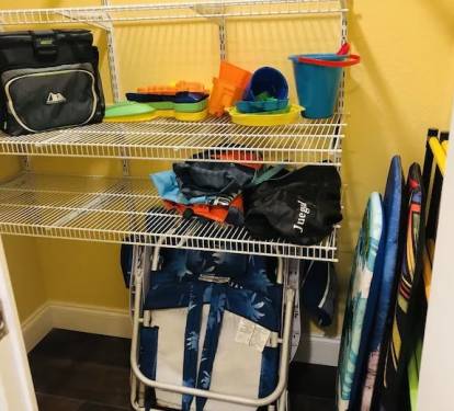 closet with toys, cooler, chairs for your use