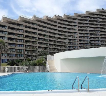 Looking up at the units from the pool