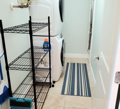 Laundry Room with Brand new XL washer and dryer, ironing board, storage