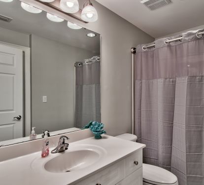 The 2nd bath is accessible from the hall and the 2nd master bedroom. 