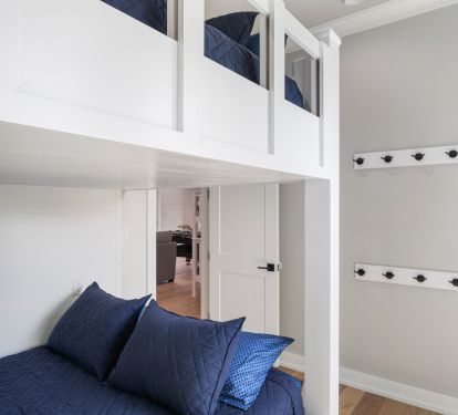custom built in queen size bunk beds, each with flat screen tv