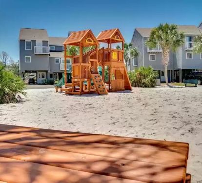 Playground w/ picnic tables and benches just steps from the house 