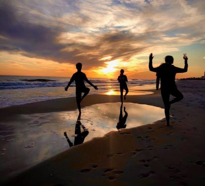 Fall sunsets are perfect on West Beach. *Yoga mat optional