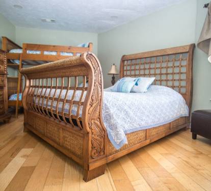 Bedroom off game room with bunk bed