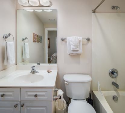 Private bath for the second bedroom has tub/shower combo. 