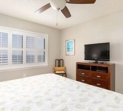 Master Bedroom with King Bed, TV and view of Gulf