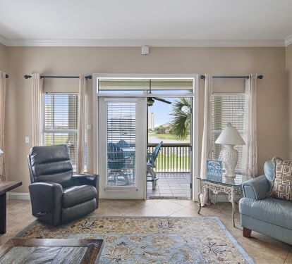 Living room leads out to large screened in deck