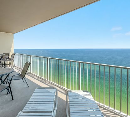 My large balcony w a balcony height table and a reg. height table w 2 loungers