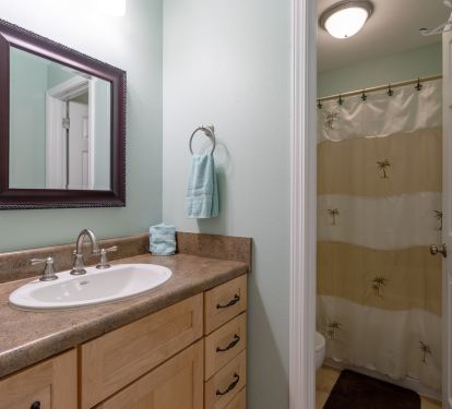 Master bath has second door for privacy  with toilet full size tub and shower