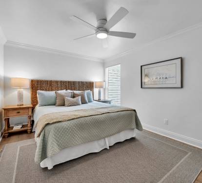 Master bedroom offers king bed, flat screen TV and ceiling fan