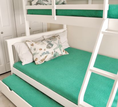 Bunk room with twin over full bunk beds with twin trundle