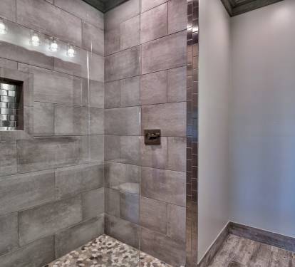 Master bath with twin vanity sinks and walk-in European shower