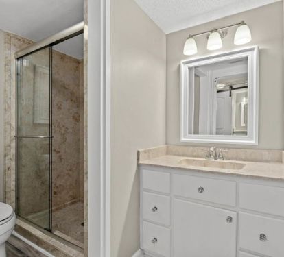 Master bathroom and vanity-barn door divides this area from the bedroom