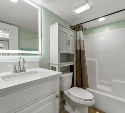 Bathroom with mirror with defogger.