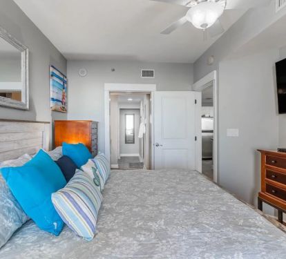 Master Bedroom with 55-inch Smart TV and access to Balcony