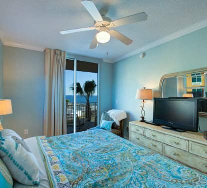 Enjoy the gorgeous beach views from this k master; see door to patio.