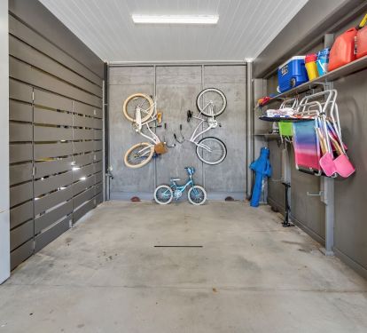 Very spacious garage comes w/what is pictured, electric golf cart, elevator cart