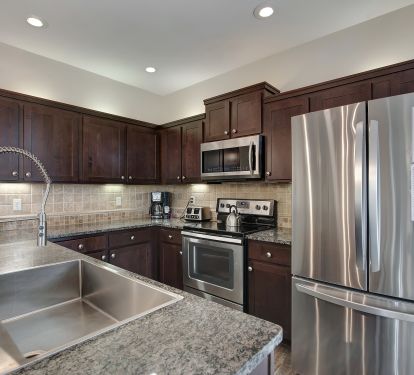 Kitchen with granite, stainless and eat-in breakfast bar