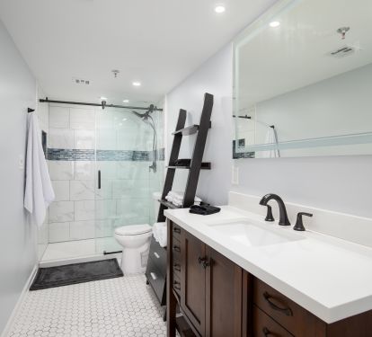 Totally renovated master bath with internally lighted mirror and walk in shower.