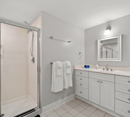 Queen Bathroom featuring tub and walk in shower 