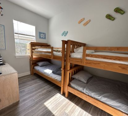 Bunk room with four twin beds