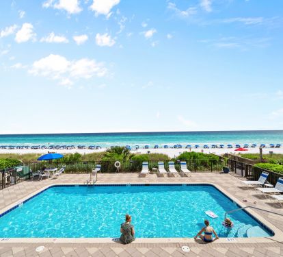 Seasonally heated pool with large deck and plenty of lounge chairs
