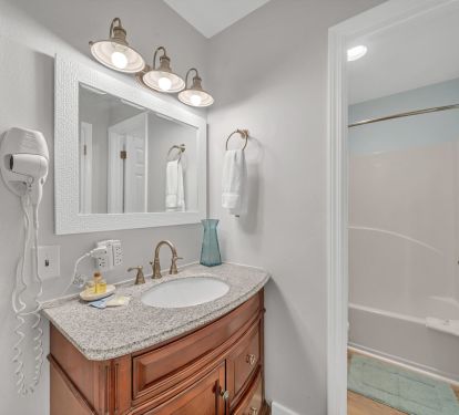 Loft bedroom with tub and shower