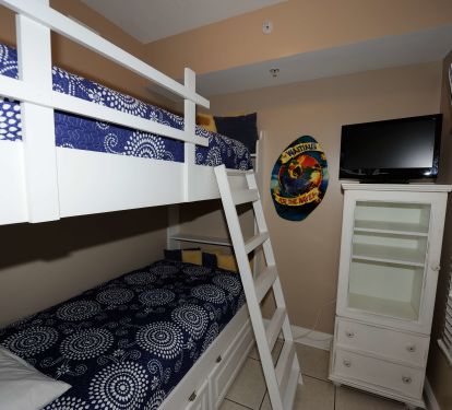 Third bedroom with built-in bunk beds and TV for the kids