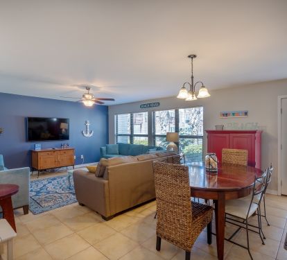 Main level family/dining room.  Back patio faces the inground pool