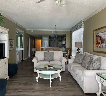 Living- in back on right is kitchen-on left is hallway to 3rd bedroom suite 