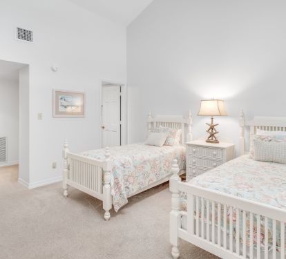 Guest bedroom has three twin beds