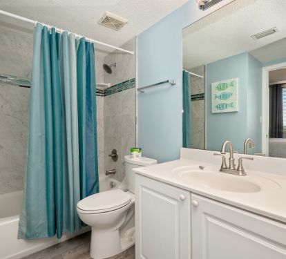 Second bathroom features an updated tub and shower