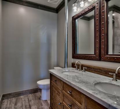 Master bath with twin vanity sinks and walk-in European shower