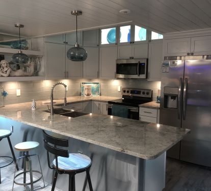 Modern coastal kitchen with state-of-the-art amenities &amp; LED lighting 