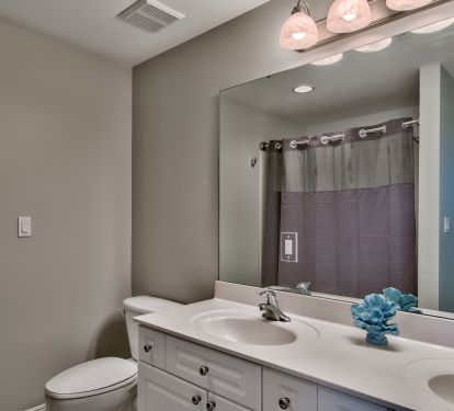 The private master bath has jetted tub/shower &amp; large vanity with double sinks. 