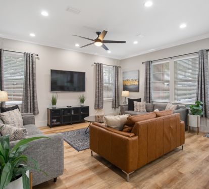 spacious living room has seating for 8