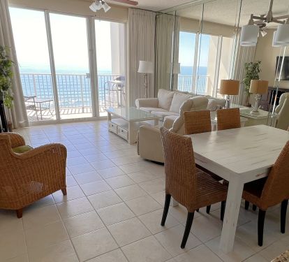 Endless water views from living, dining, kitchen.  Slipcovered sofa. Roku 55 TV.