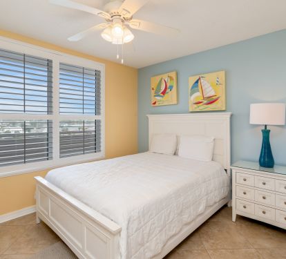 Second bedroom offers a queen bed and direct access to the guest full bathroom