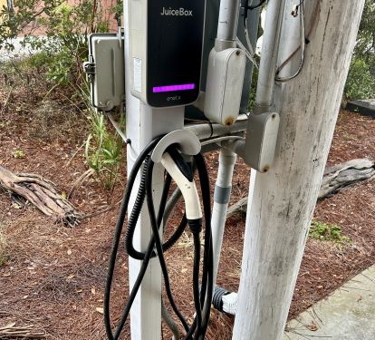 JuiceBox EV charging station is located in the carport area for guest use