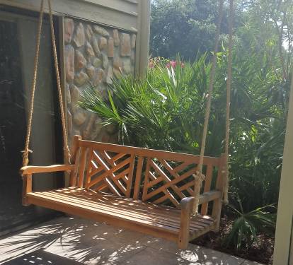 Beautiful Cedar swing on patio