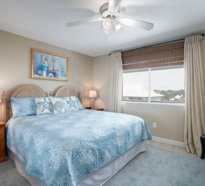 2nd master suite with comfortable king bed and en-suite bathroom.